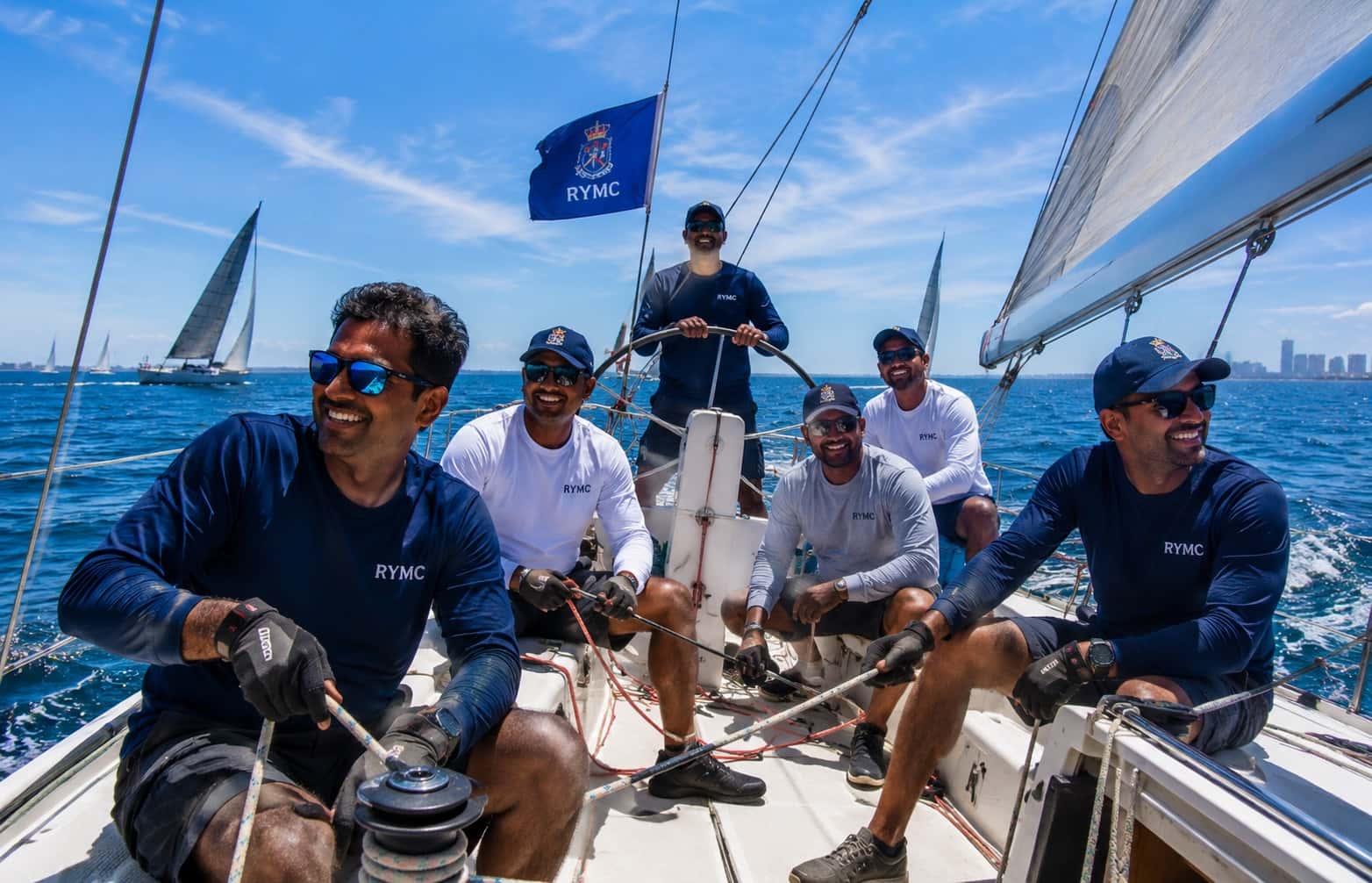 RMYC crew members racing under the club flag